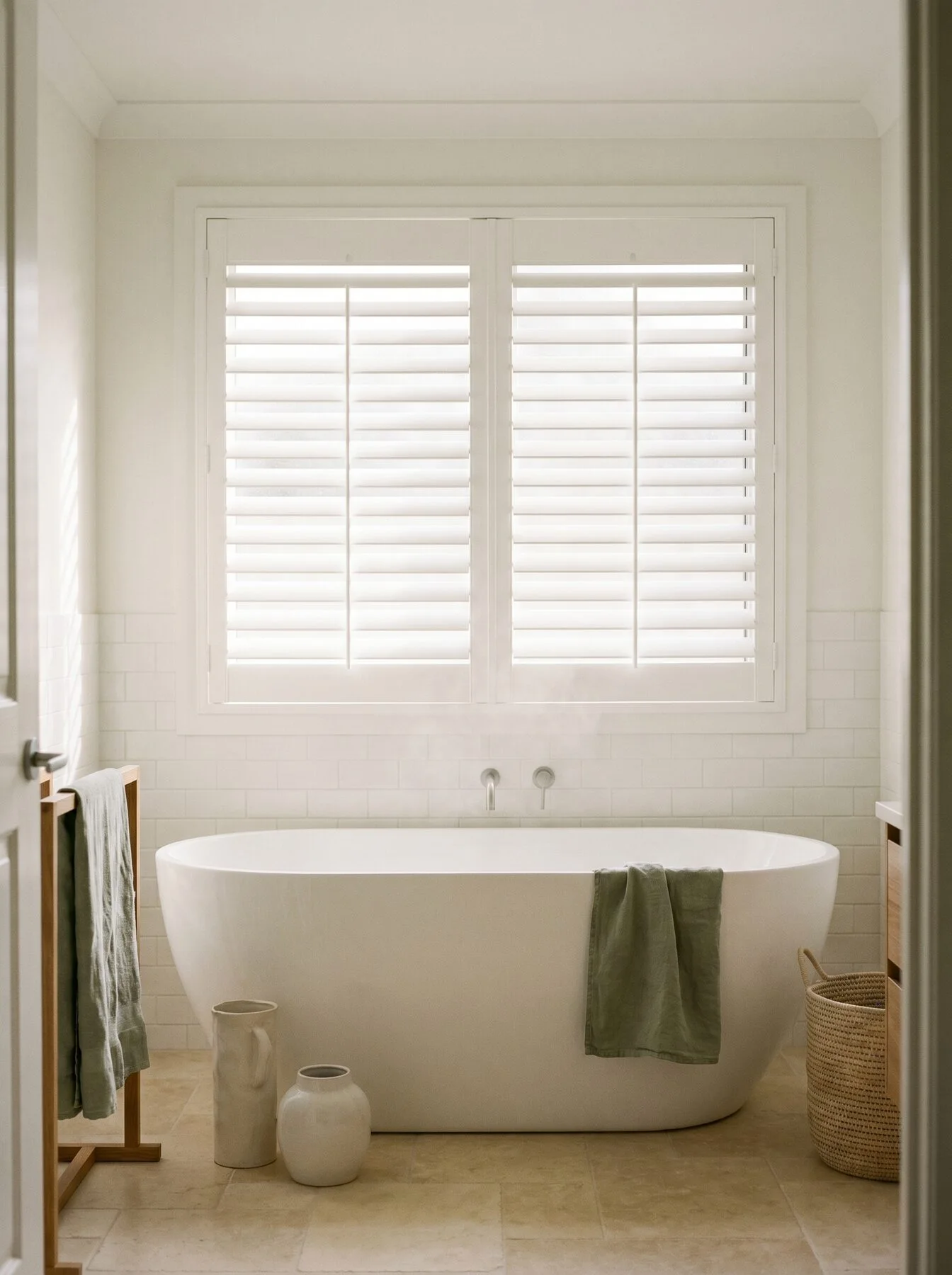 White waterproof PVC shutters above a freestanding bath